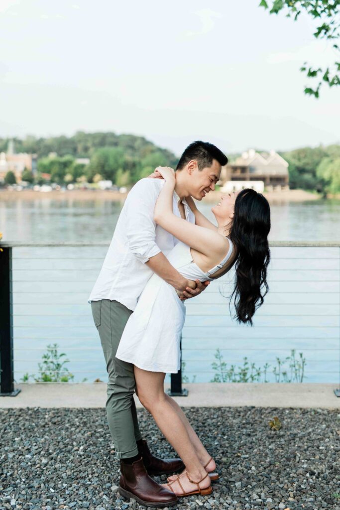 Victoria and Jimmy walking hand-in-hand during their engagement session at Goat Hill Overlook with New Hope engagement photographer