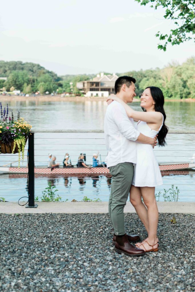 Victoria and Jimmy walking hand-in-hand during their engagement session at Goat Hill Overlook with New Hope engagement photographer
