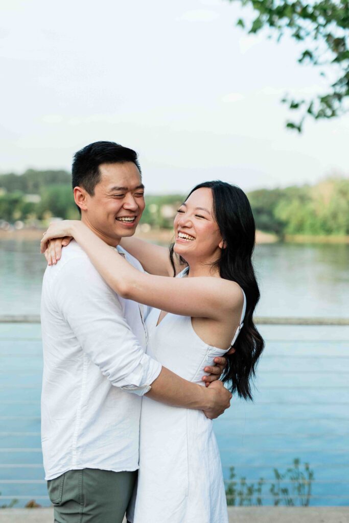 Victoria and Jimmy walking hand-in-hand during their engagement session at Goat Hill Overlook with New Hope engagement photographer