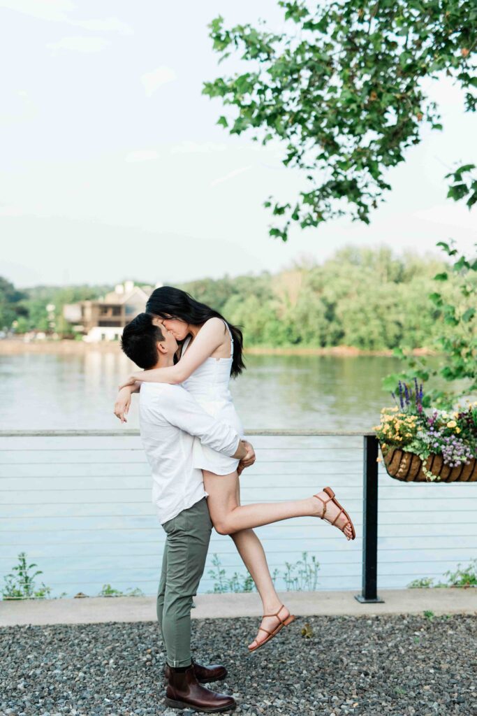 Victoria and Jimmy walking hand-in-hand during their engagement session at Goat Hill Overlook with New Hope engagement photographer