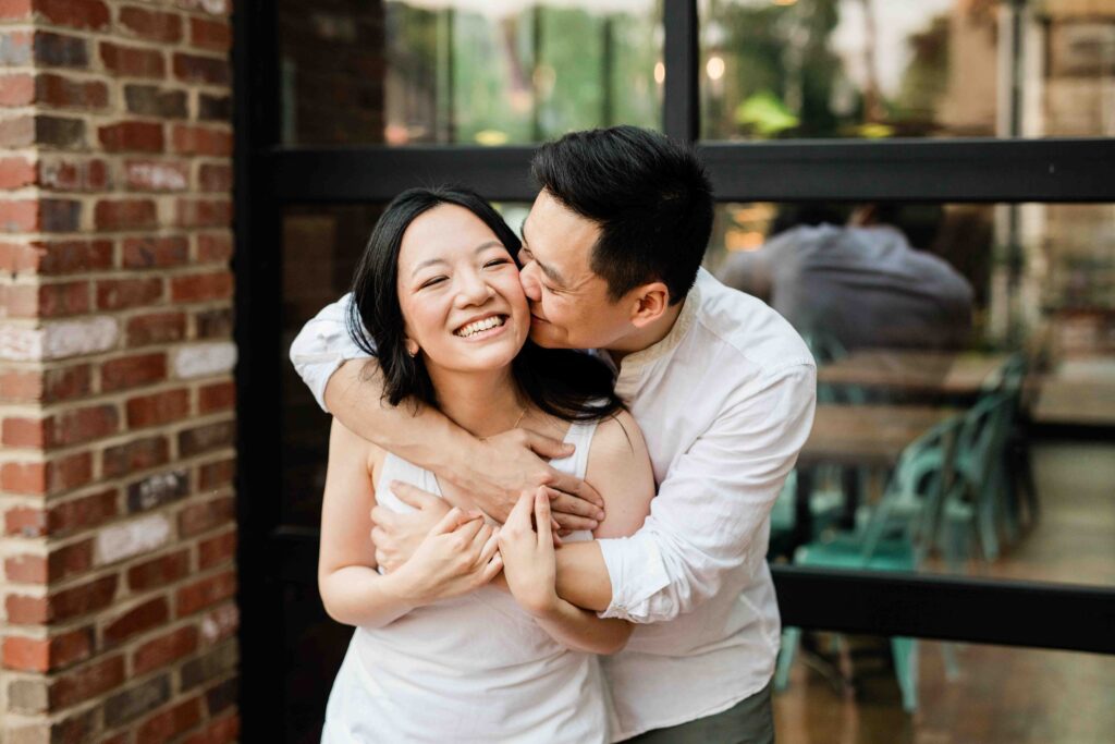 Victoria and Jimmy walking hand-in-hand during their engagement session at Goat Hill Overlook with New Hope engagement photographer