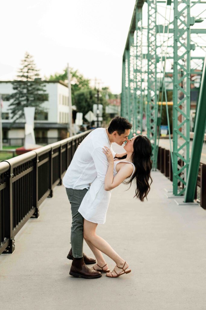 Victoria and Jimmy walking hand-in-hand during their engagement session at Goat Hill Overlook with New Hope engagement photographer